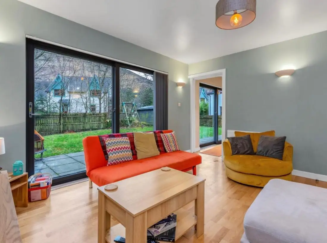 Bright living room with full-height glazing